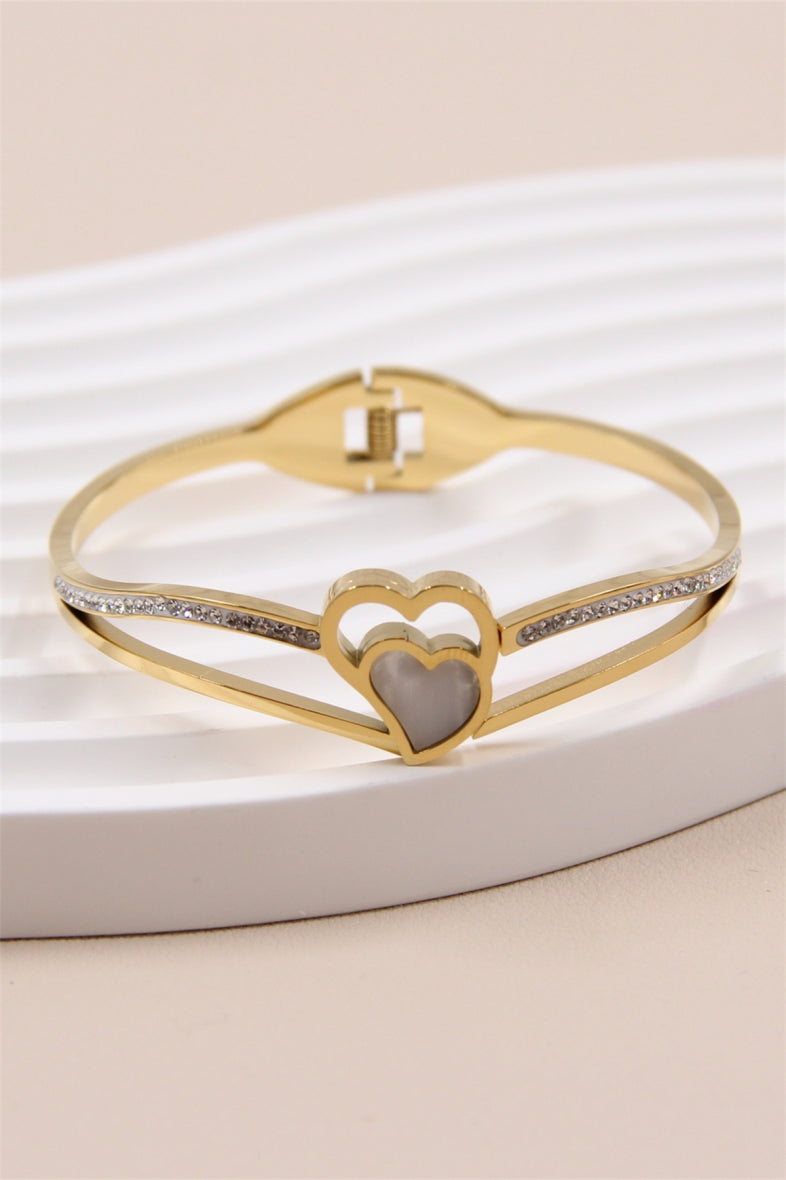 Bangle/armband met steentjes en parelmoeren hart